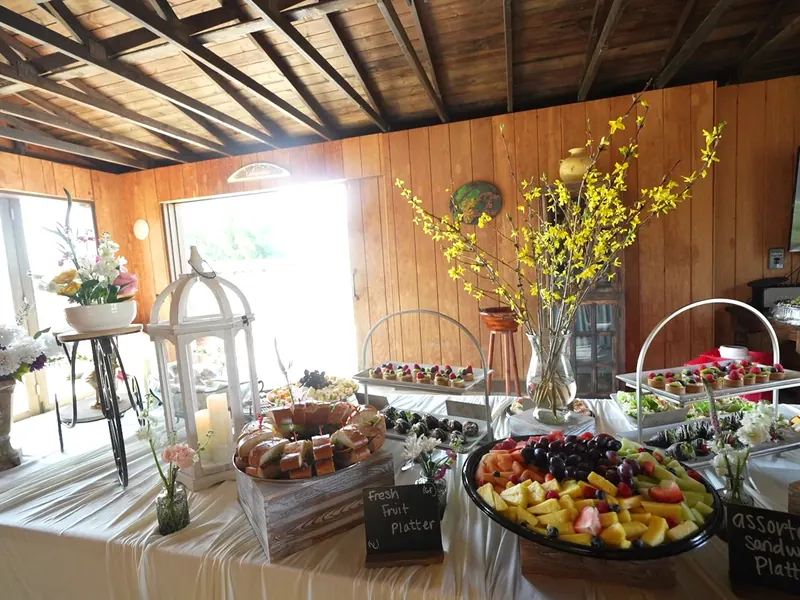 Sandwich, fruit and dessert buffet with chalkboard signs at a Sunol ranch property